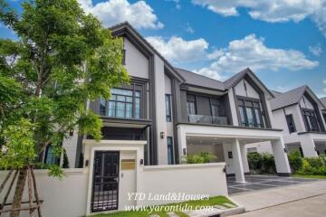 Modern two-story house with a landscaped front yard