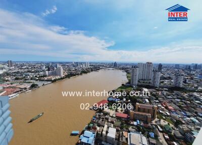 Aerial view of a river with buildings and city skyline