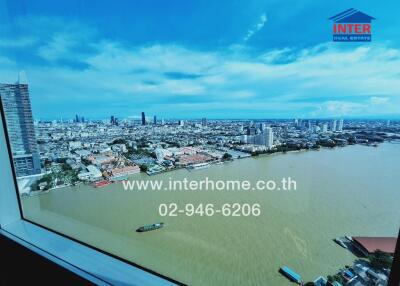 View of cityscape and river from window of high-rise building