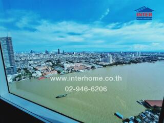 View of cityscape and river from window of high-rise building