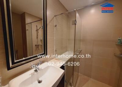 modern bathroom with sink, mirror and glass shower