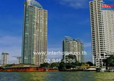 Exterior view of high-rise residential buildings near a river