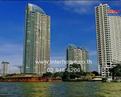 Exterior view of high-rise residential buildings near a river