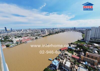 Aerial view of a river with surrounding cityscape