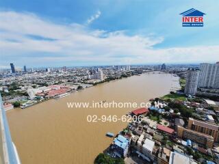 Aerial view of a river with surrounding cityscape