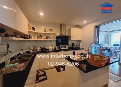 Modern kitchen with black countertops and white cabinets