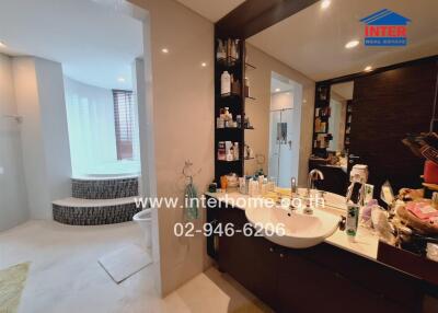 Modern bathroom with amenities and a bathtub