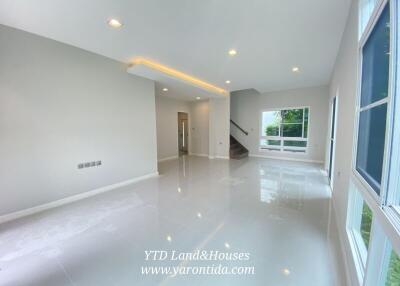 Spacious living room with large windows