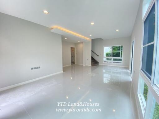 Spacious living room with large windows