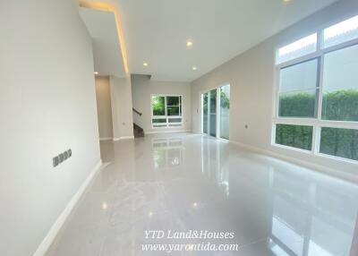 Spacious, well-lit living room with large windows