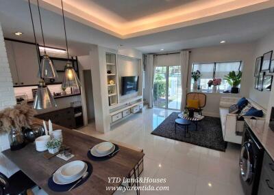 Modern living room with open kitchen and dining area