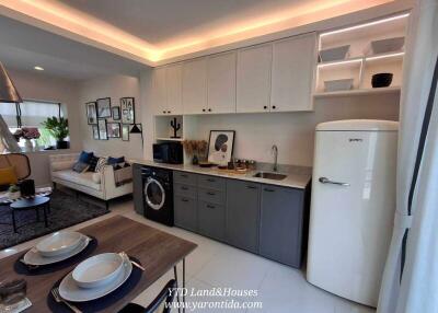 Modern kitchen with dining area and living space