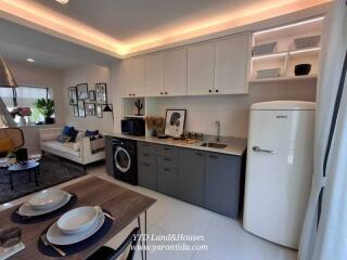 Modern kitchen with dining area and living space