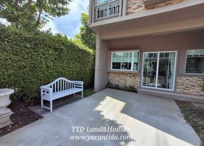 Outdoor patio area with bench