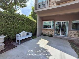 Outdoor patio area with bench