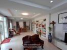 Spacious living room with wooden furniture and decorative shelving