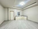 Modern kitchen with white cabinetry and recessed lighting