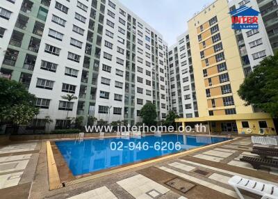 Exterior view of apartment complex with swimming pool