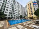 Exterior view of apartment complex with swimming pool