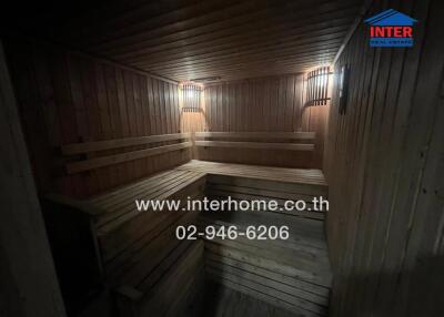 Wooden sauna with benches and wall lights