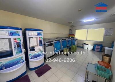 Laundry room with multiple washing machines and reverse osmosis machines