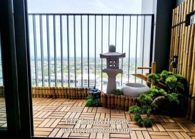 Balcony with bamboo decor and city view