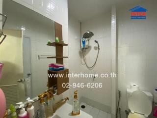 Bathroom with shower and sink