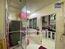 Modern kitchen with glass partition and purple cabinets