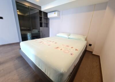 Spacious bedroom with a large bed and built-in wardrobe