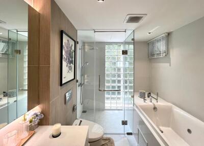 Modern bathroom with glass shower and bathtub