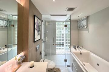 Modern bathroom with glass shower and bathtub