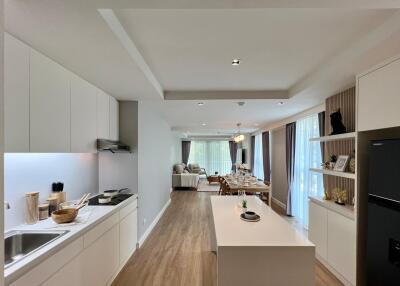 Open concept kitchen and living area with modern furnishings