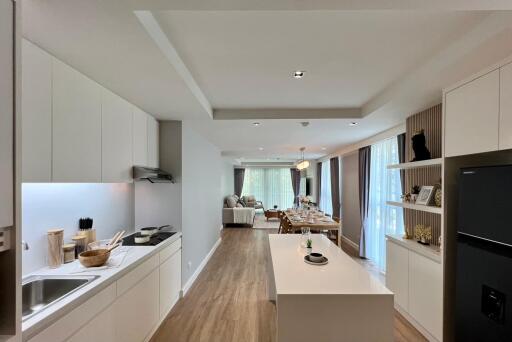 Open concept kitchen and living area with modern furnishings