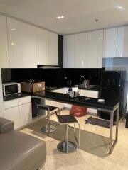 Modern kitchen with black and white cabinetry and island