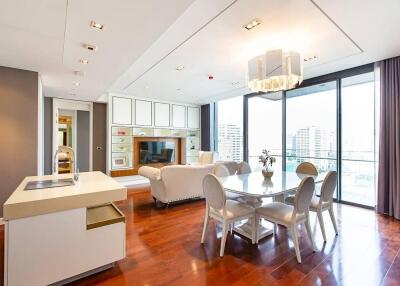 Modern living and dining area with city view