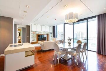 Modern living and dining area with city view