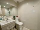 Modern bathroom with spacious mirror and white sink