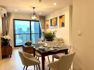 Living room with dining area and city view