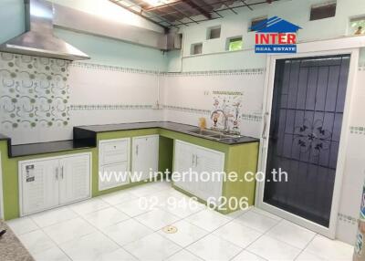 Spacious kitchen with modern appliances and ample counter space