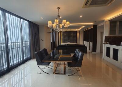 Spacious living room with modern furnishings and dining area