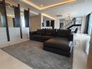 modern living room with black sofa and dining area