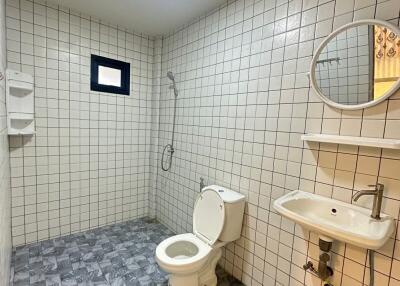 Modern bathroom with tiled walls and floor