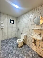 Modern bathroom with tiled walls and floor