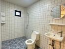 Modern bathroom with tiled walls and floor