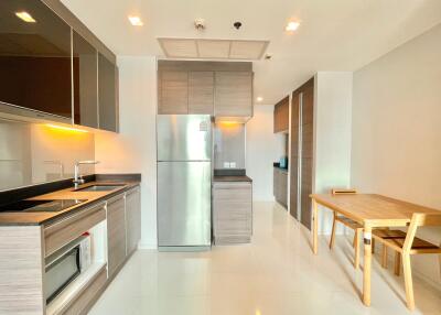 Modern kitchen with dining area and appliances