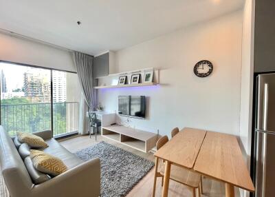 Modern living room with dining area and large window