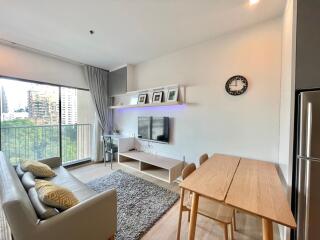 Modern living room with dining area and large window