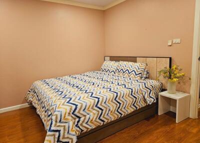 Cozy bedroom with chevron patterned bedding