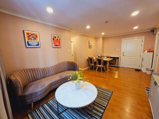 Spacious, well-lit living room with modern decor