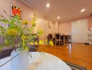 Living room with dining area and entrance door